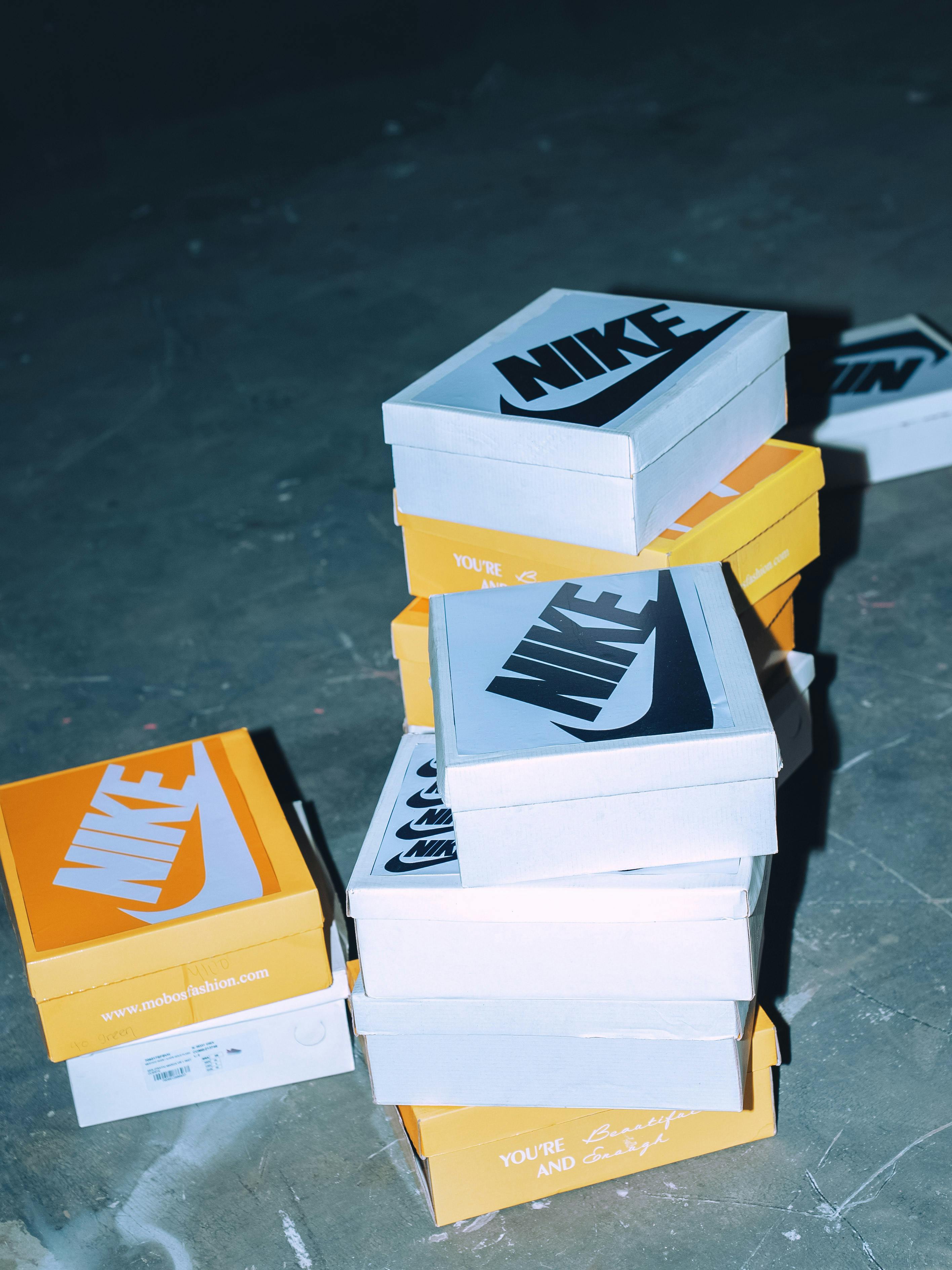 Stack of sneaker boxes showcasing a variety of sneakers